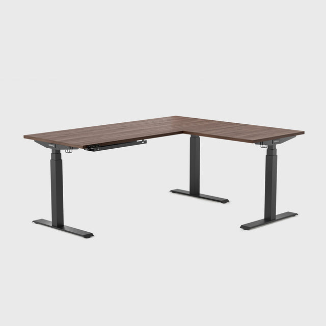 This spacious L-shaped standing desk provides a generous surface for dual monitors, tablets, or paperwork — all while supporting extended use throughout your day, essentially functioning as a corner standing computer desk with room for all your gear.